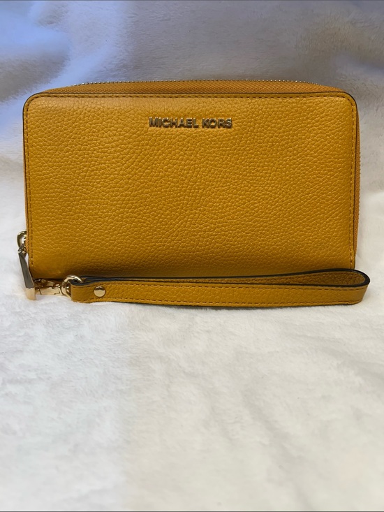 Michael Kors Handbags - New Michael Kors Jet Set Travel Large Flat phone case Leather Marigold